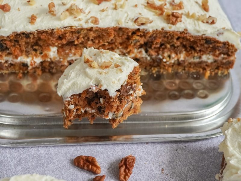 brown and white cake on clear plastic container