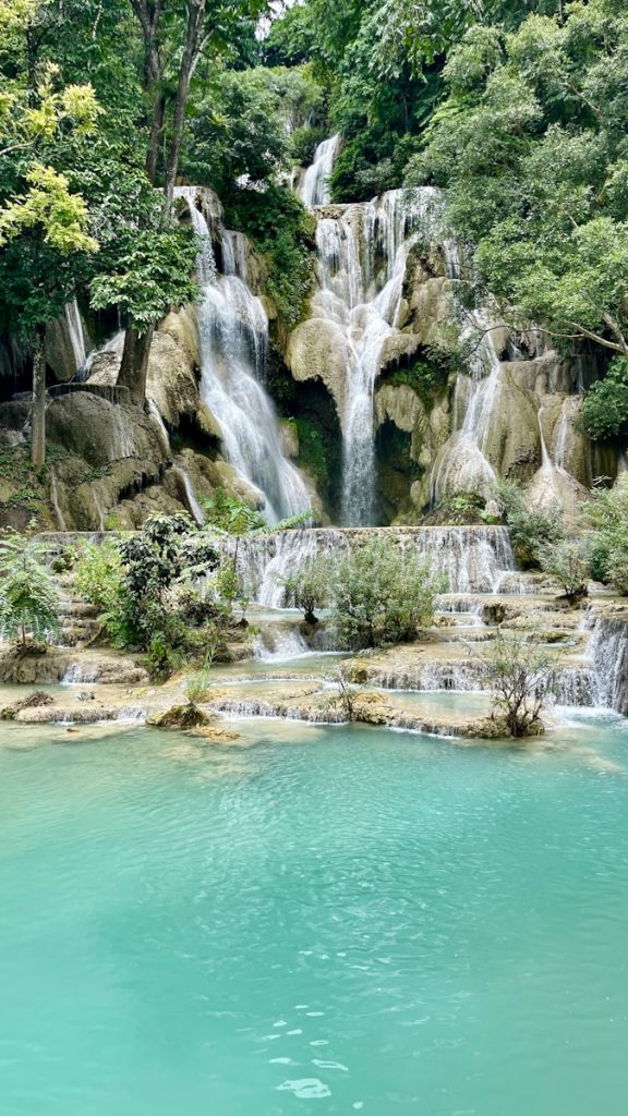 a waterfall in the middle of a body of water